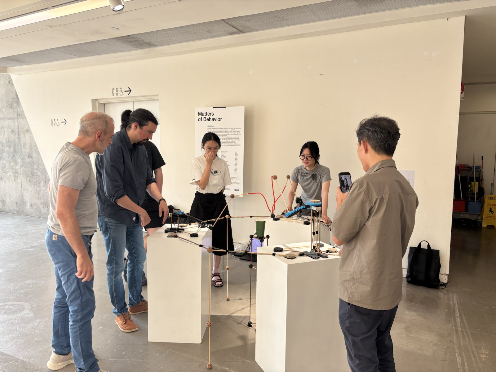 Visitors gathering around A game that pulls during the public showcase